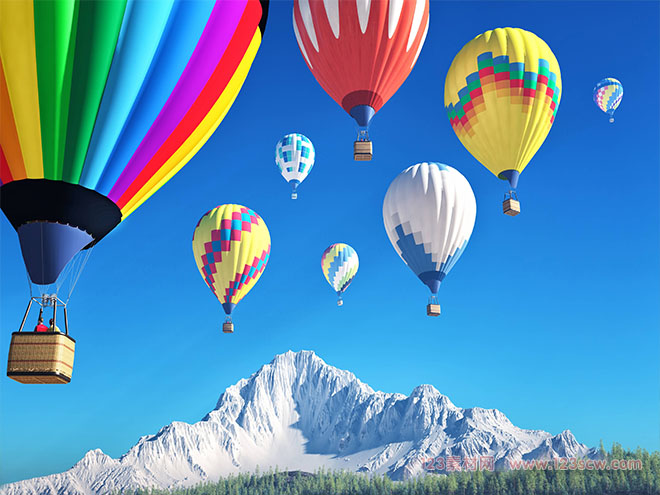 飞翔在雪山之巅的热气球高清图片